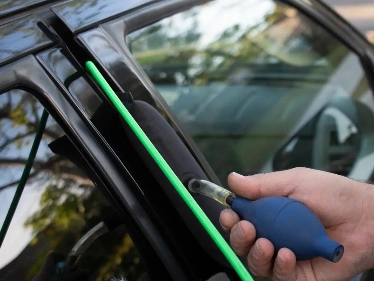 Automotive reach tool and air wedge opening a locked car door without damage in Milwaukee